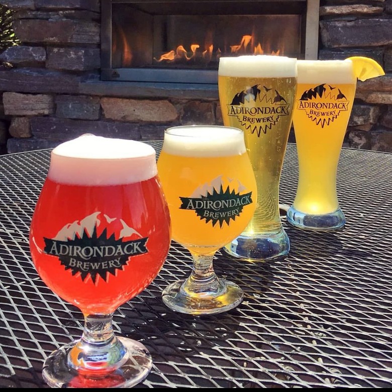 four beers in a row on a table