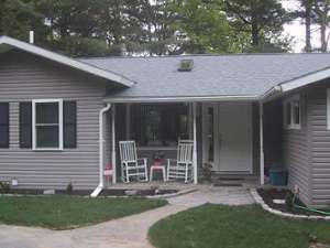 exterior of spruce knoll, a gray house