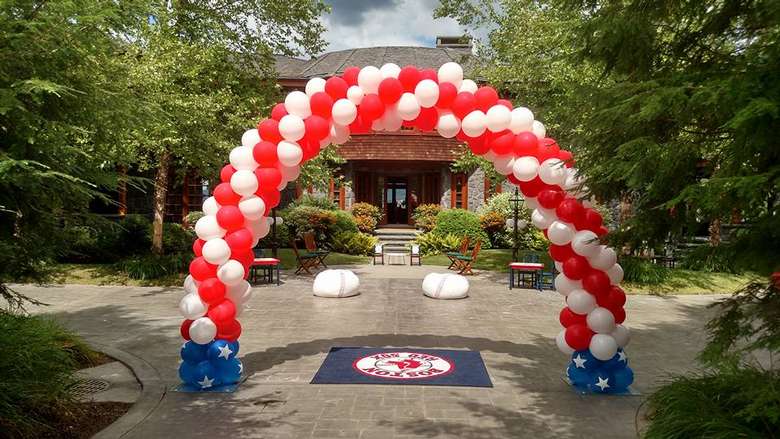 A red white and blue balloon arch