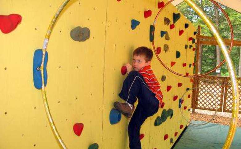 boy climbing on a rockwall