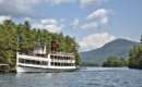 the mohican cruise ship driving past islands on lake george