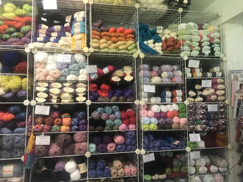 colorful yarn displayed in a store