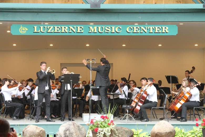a concert being performed under Luzerne Music Center sign