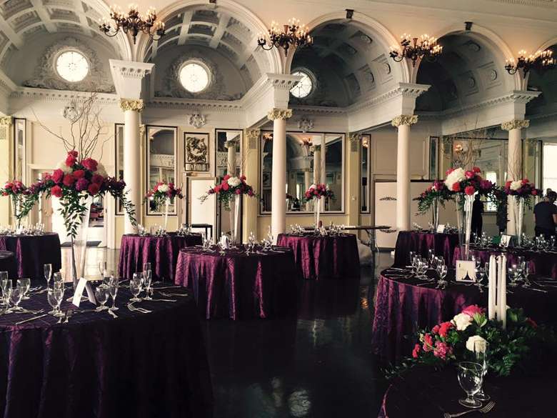 Flower bouquets on tables in a hall