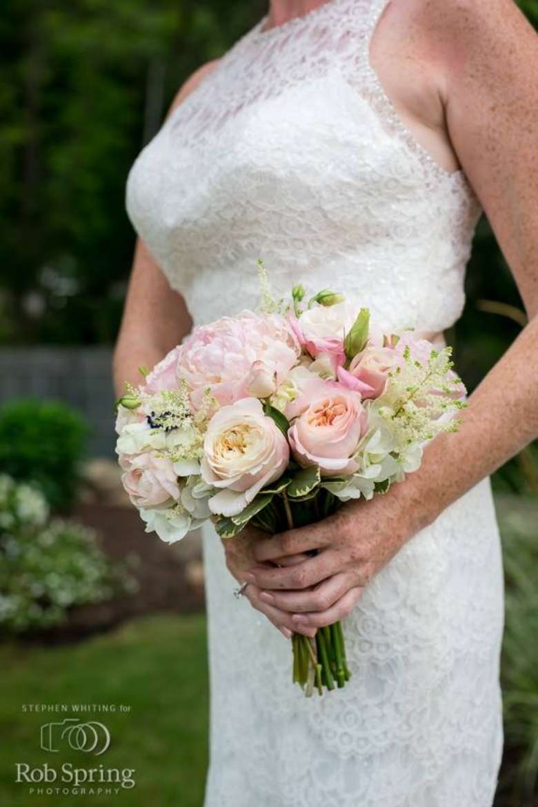 woman in Wedding dress and bouquet outdoors