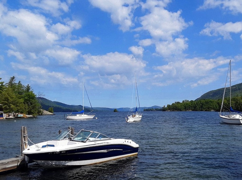 motorboat and sailboats on Lake George
