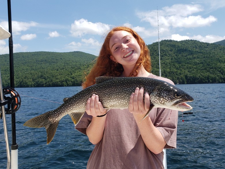 girl holding fish