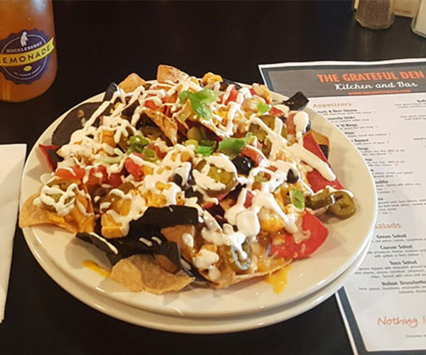 plate of nachos and grateful den menu