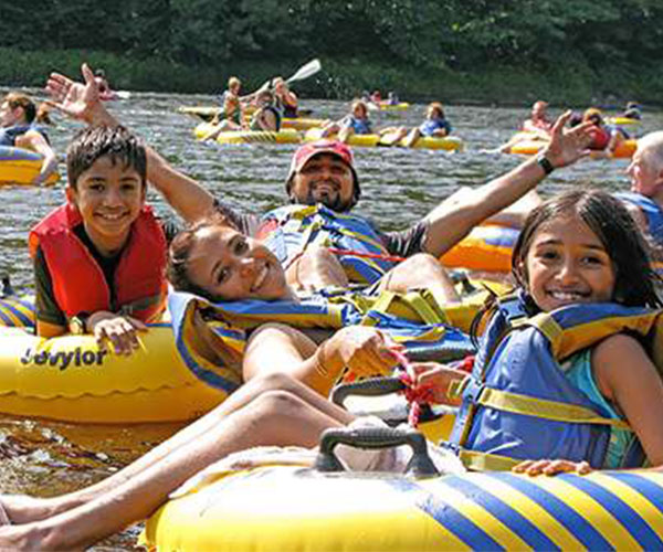 family tubing down a river