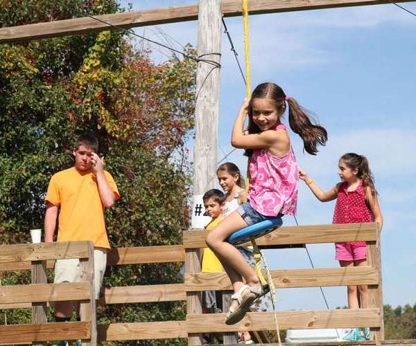 girl zip lining at Ellms Family Farm