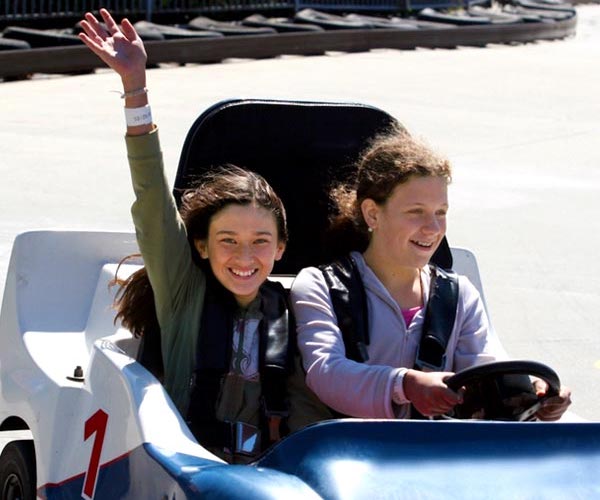 two girls in go karts