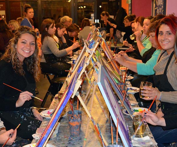 women painting at Saratoga paint & sip