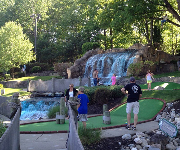 people at pirate's cove mini golf course