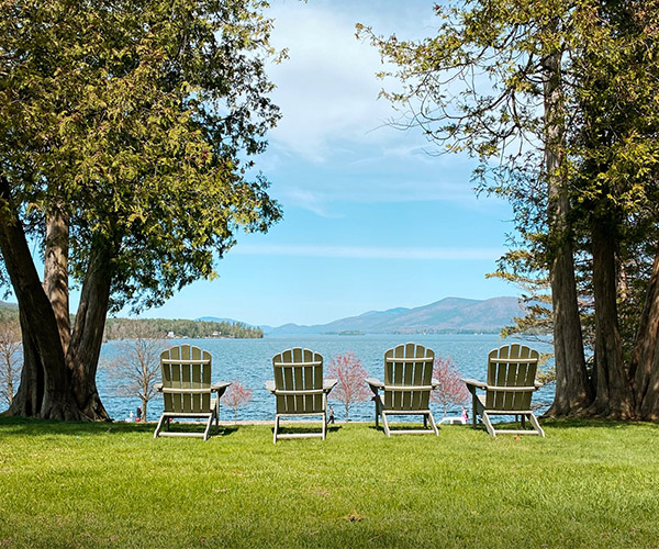 four adirondack chairs overlooking lake george