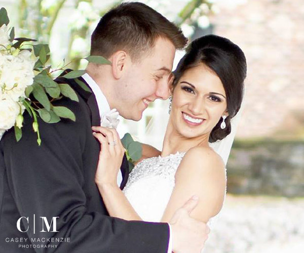 bride and groom smiling