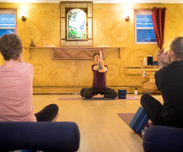 woman leading a yoga class