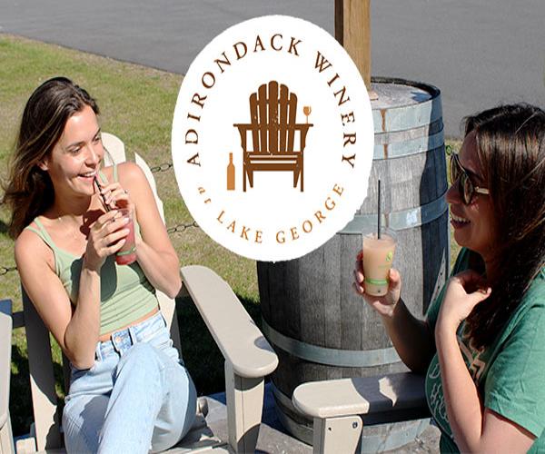 Two women sipping drinks at the Adirondack Winery in Lake George