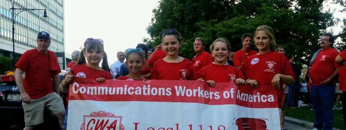 kids holding up Communications Workers of America banner