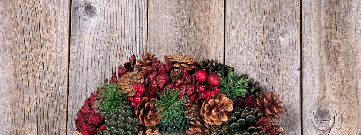holiday wreath decorated with pinecones