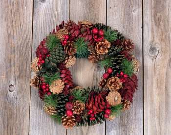 holiday wreath decorated with pinecones