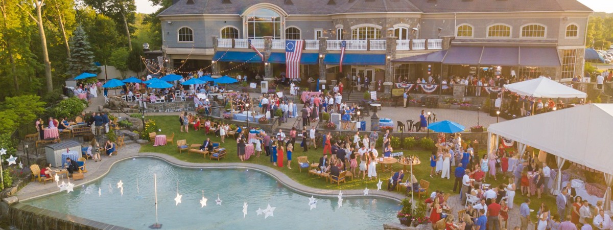 crowd on the patio at prime at saratoga national