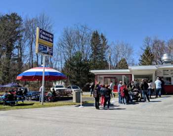 people waiting in line at the country drive-in