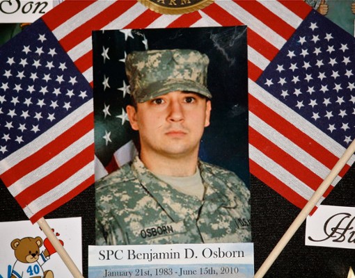 image of Ben Osborn surrounded by flags