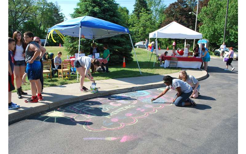 some people making chalk drawings