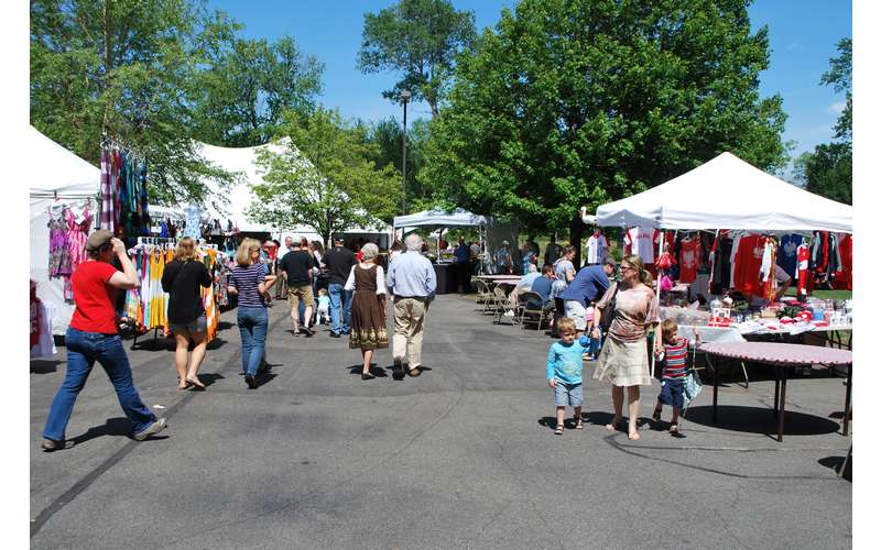 vendors and craft tables set up at a festival