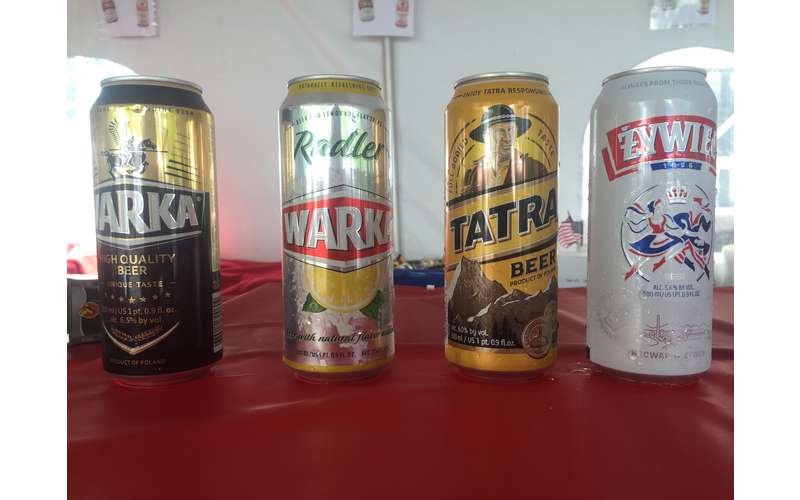 four polish drinks in cans