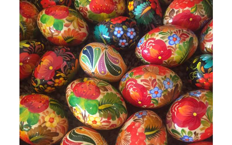 colorful eggs with painted images on them