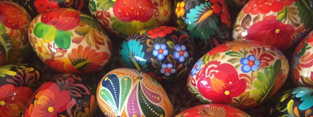 colorful eggs with painted images on them