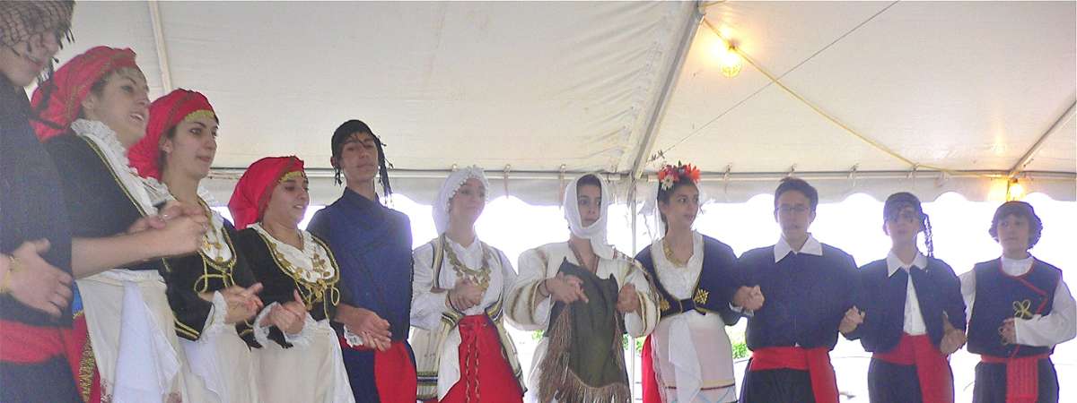 group dressed in traditional greek attire