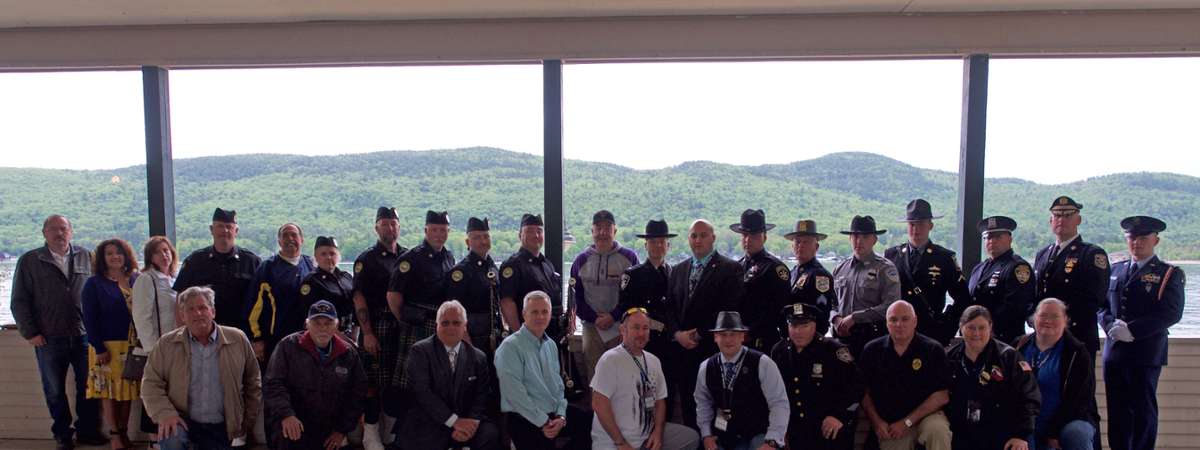 a few dozen officers pose together