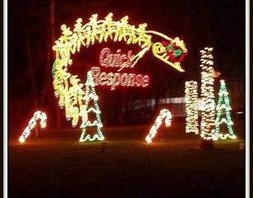Quick Response spelled out in holiday lights with Santa and his reindeer