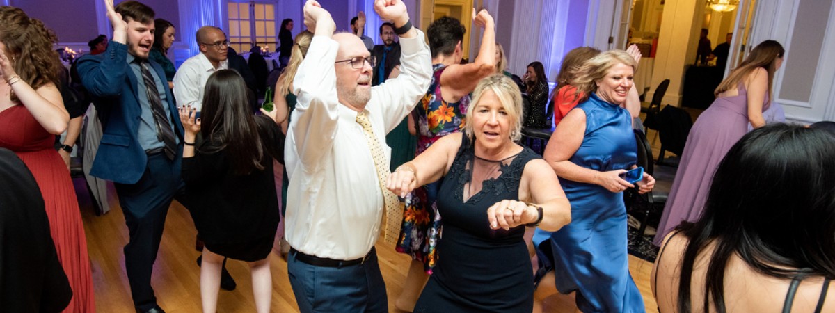 People dacingon dance floor at Party