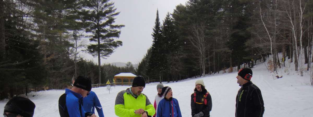 Snowshoe runners checking times