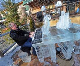 man playing an ice piano