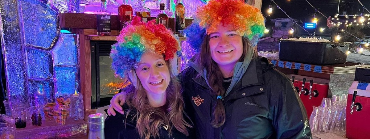 two women at an ice bar at night