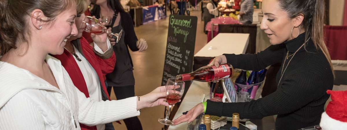 Photo of a booth serving wine at the Albany Wine & Chocolate Festival