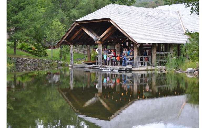 group looking at a pond from the exit of the museum