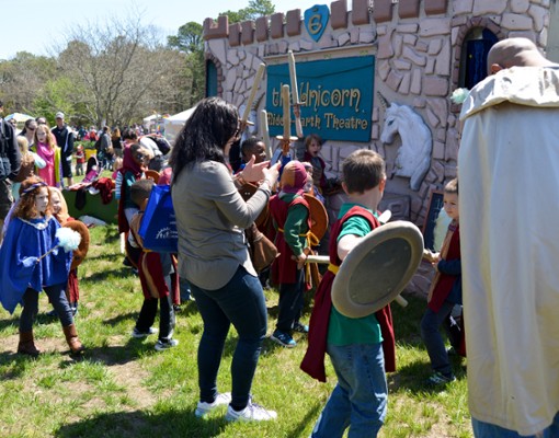 kids outside a play theatre castke