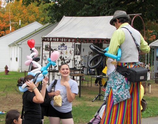 man on stilts at festival