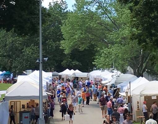people near vendor tents