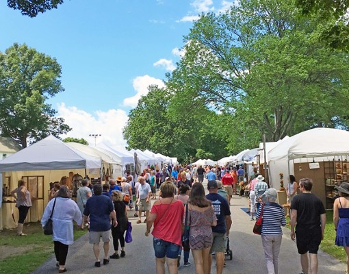 people exploring a festival