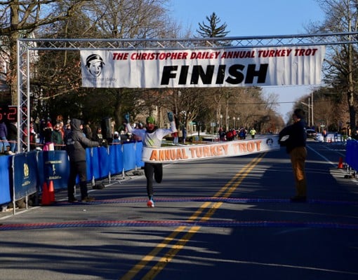 a runner crossing the finish line