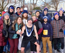 a group of runners posing for a photo