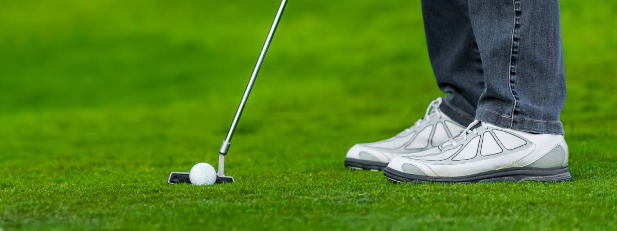 person golfing