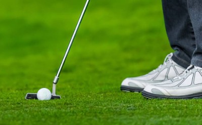 person golfing