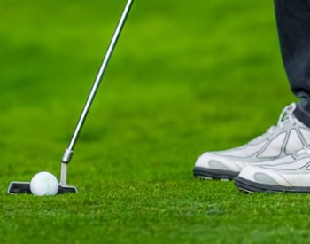 person golfing